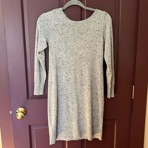 Sweater dress with detail at the back neck.